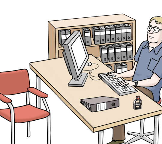 ein Mann, der am Schreibtisch sitzt und arbeitet